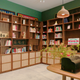Inside the Museum of Chinese in America's new workshop space, showcasing archival items on bookcases and along a table.